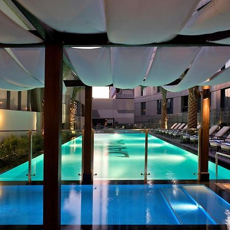 Damac Maison The Vogue Дубай Экстерьер фото The pool at the hotel