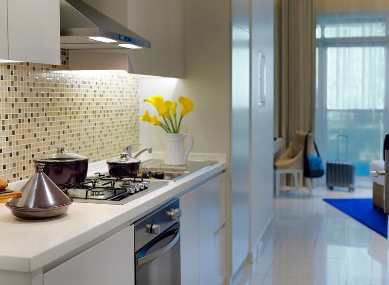 Damac Maison The Vogue Дубай Экстерьер фото A typical kitchen
