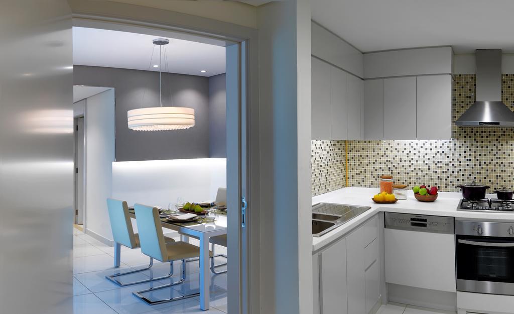 Damac Maison The Vogue Дубай Экстерьер фото A kitchen in a private home
