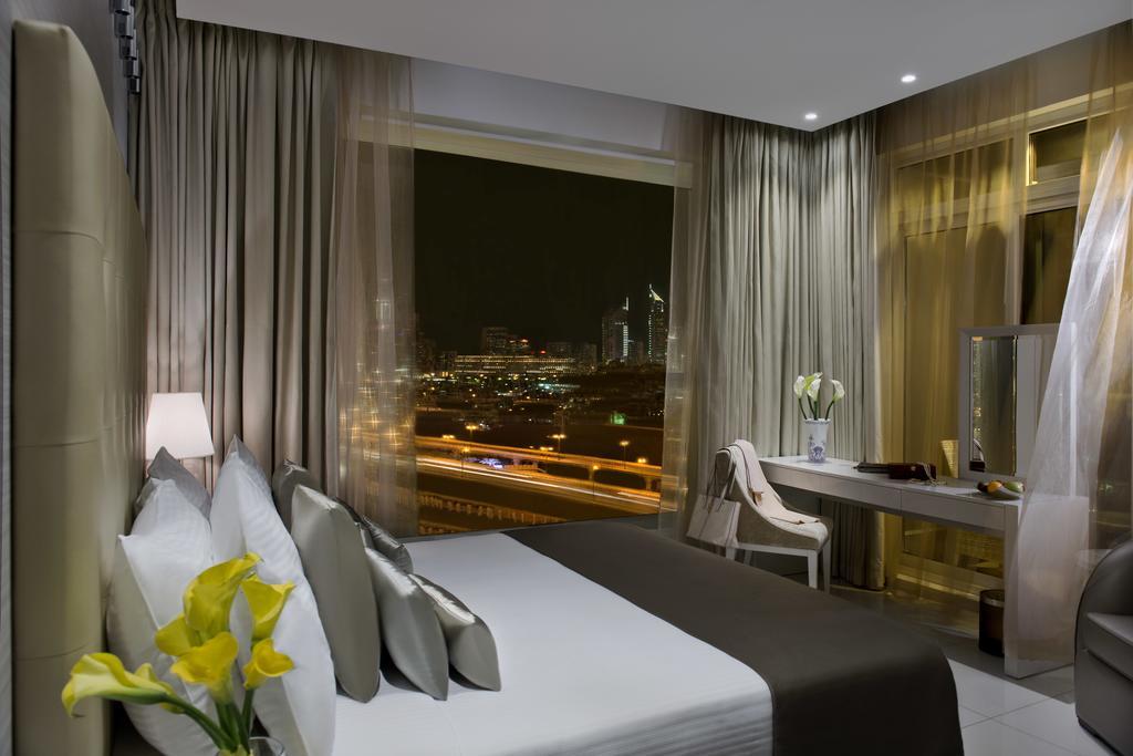 Damac Maison The Vogue Дубай Экстерьер фото A room at the hotel