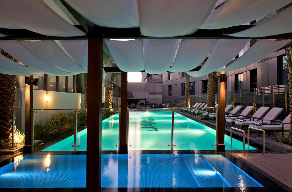 Damac Maison The Vogue Дубай Экстерьер фото The pool at the hotel