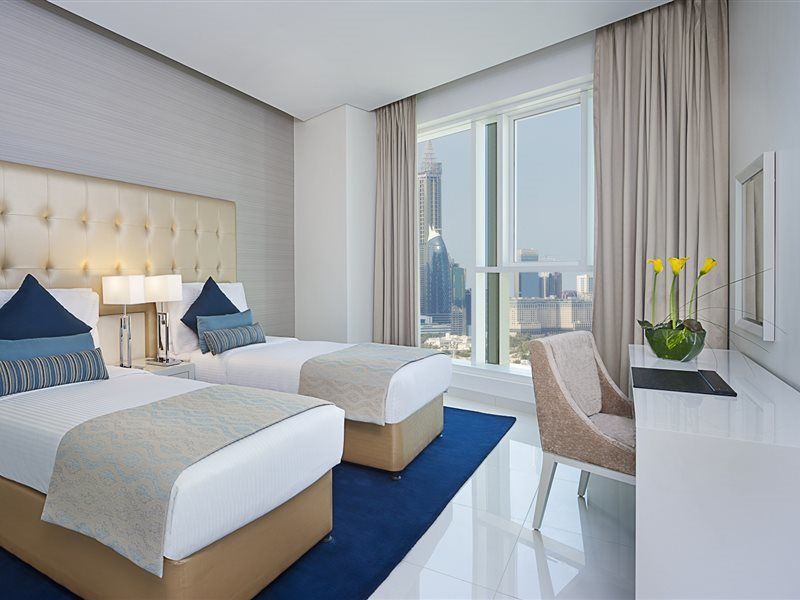 Damac Maison The Vogue Дубай Экстерьер фото A guest room at the Address Downtown Hotel