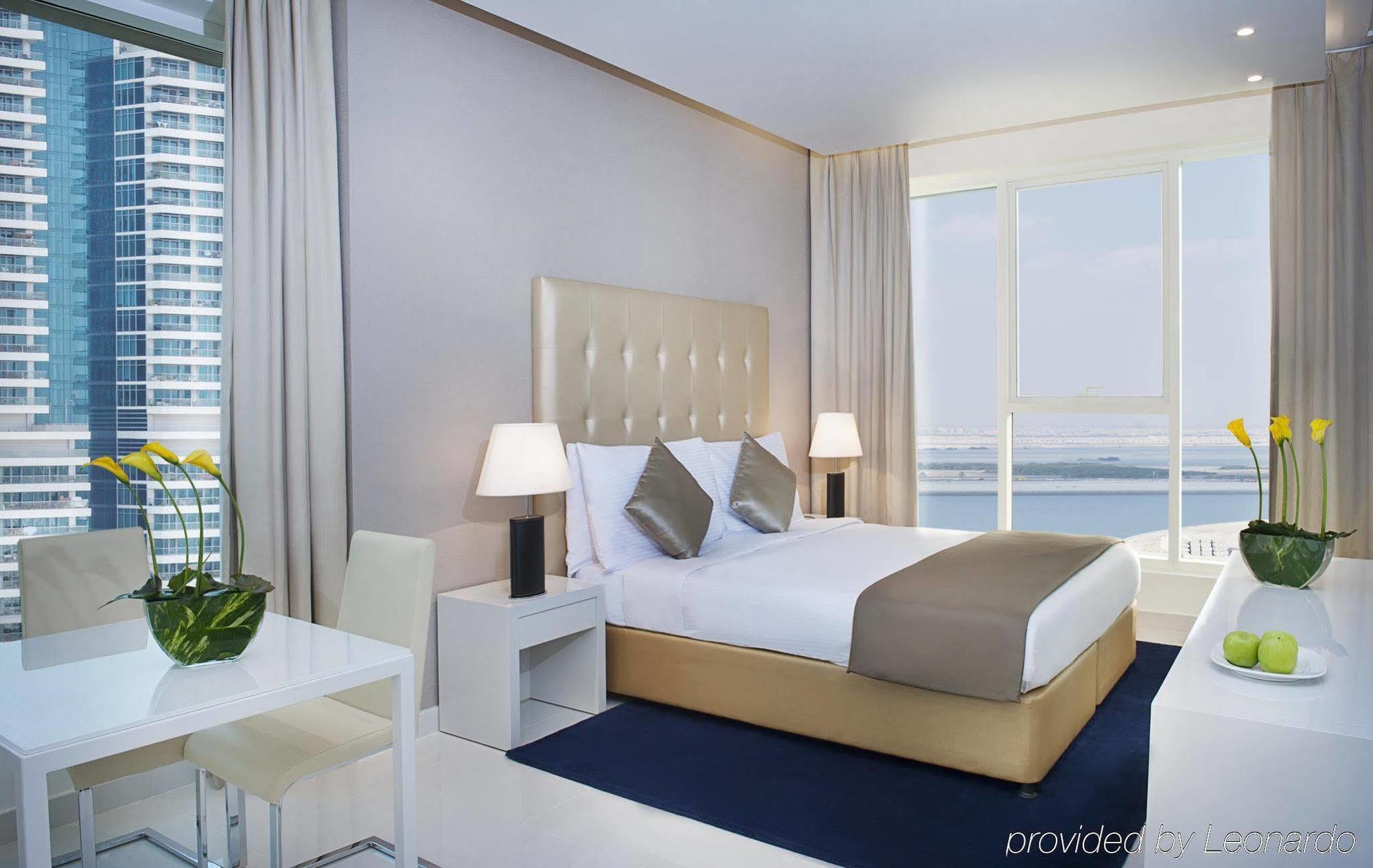 Damac Maison The Vogue Дубай Экстерьер фото A bedroom at the Address Downtown Hotel