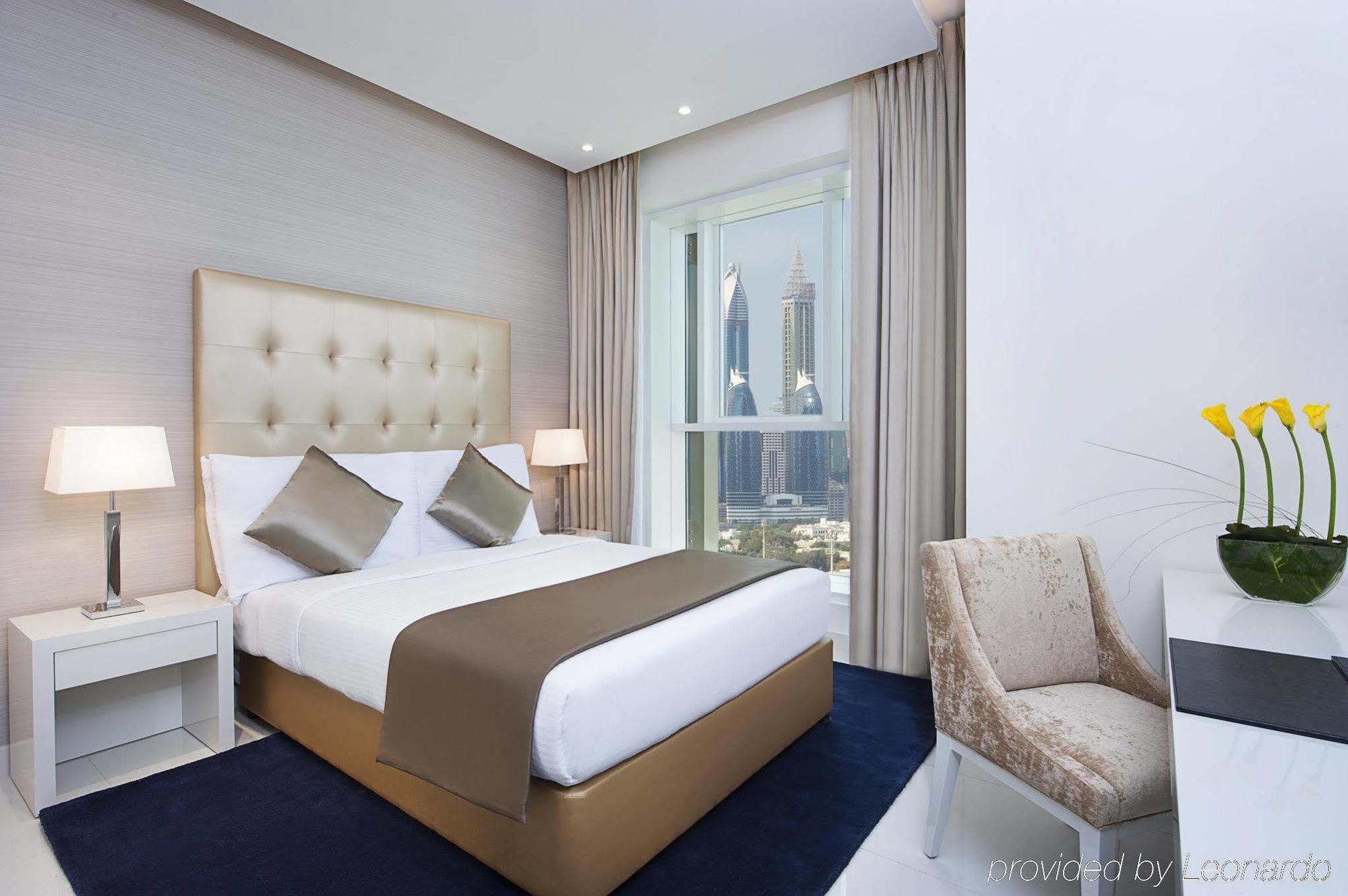 Damac Maison The Vogue Дубай Экстерьер фото A bedroom at the hotel