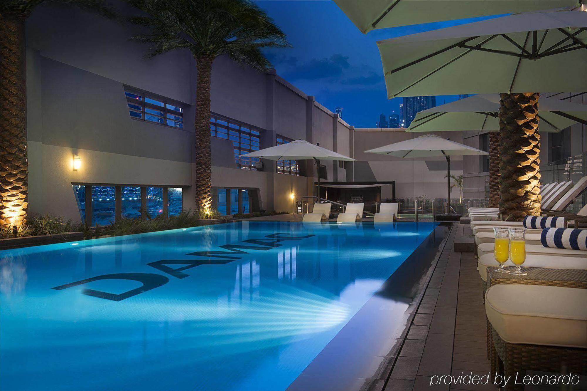 Damac Maison The Vogue Дубай Экстерьер фото The pool at the hotel