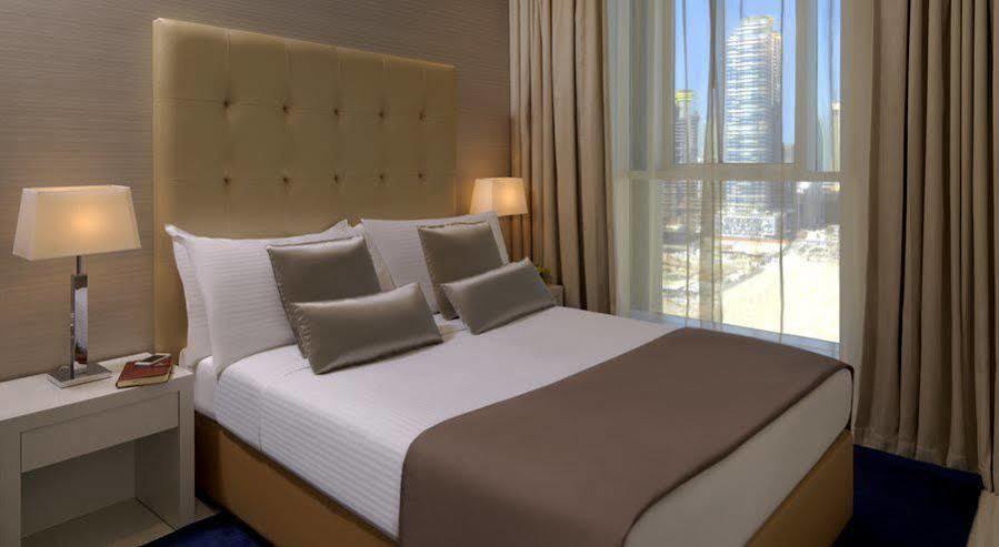 Damac Maison The Vogue Дубай Экстерьер фото A bedroom
