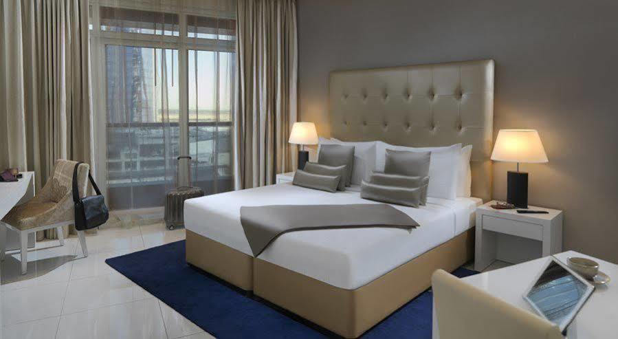 Damac Maison The Vogue Дубай Экстерьер фото A bedroom at the hotel