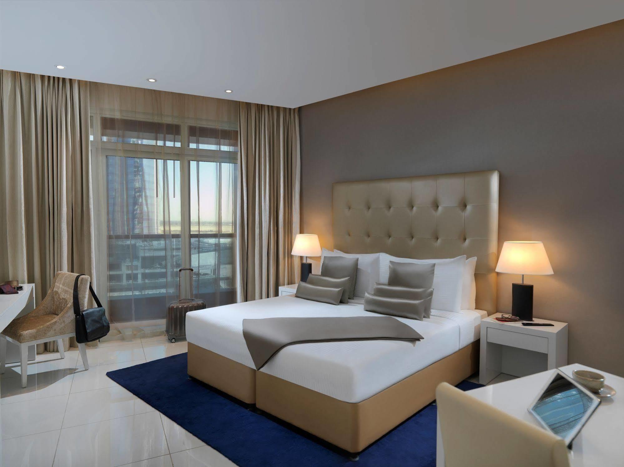 Damac Maison The Vogue Дубай Экстерьер фото A bedroom at the hotel