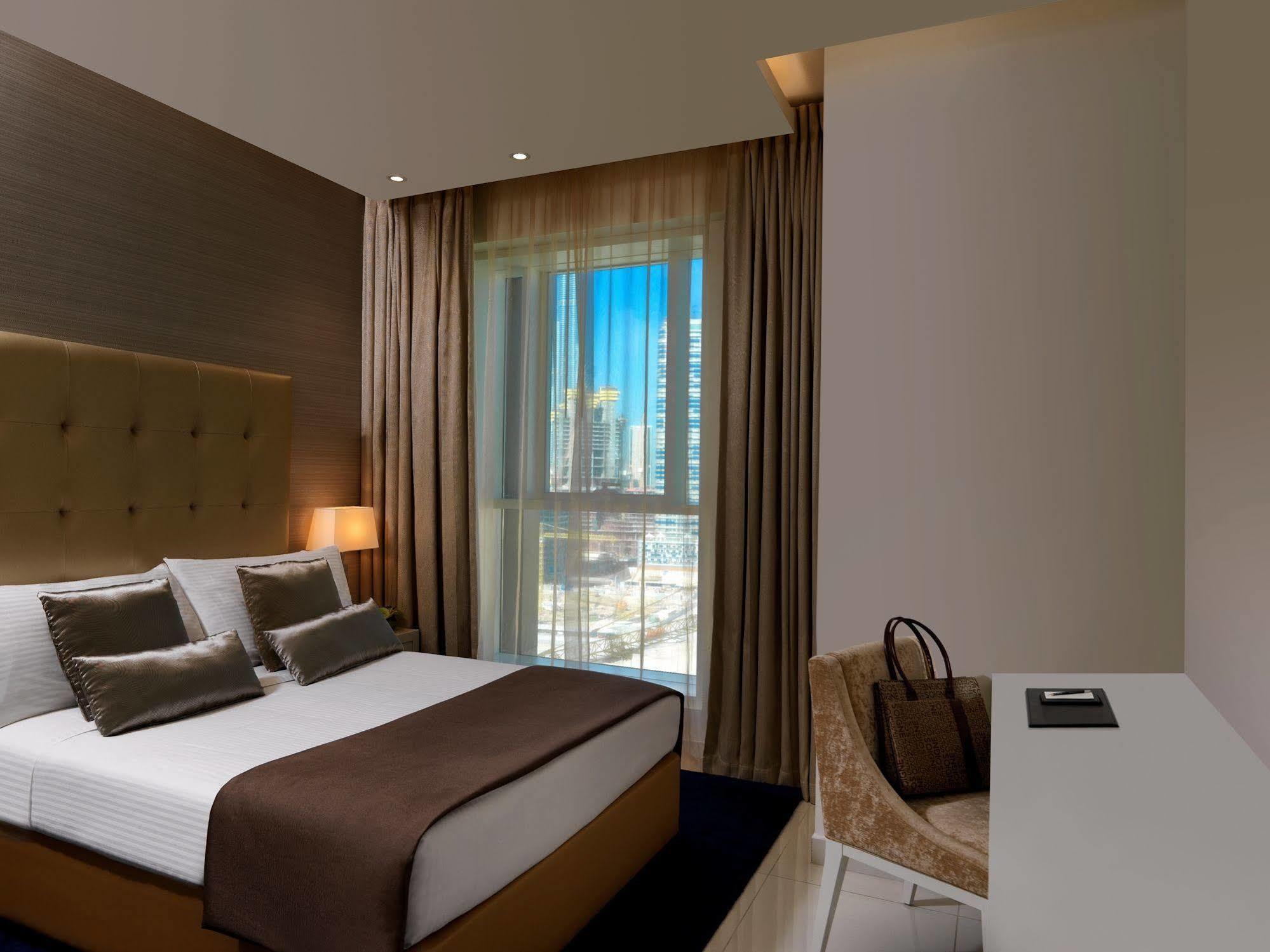 Damac Maison The Vogue Дубай Экстерьер фото A bedroom at the hotel